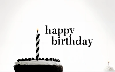 A Birthday cake with a candle on it and a happy Birthday message in the background with a white frosting and black icing on the cake, plain background, a pastel, international typographic style