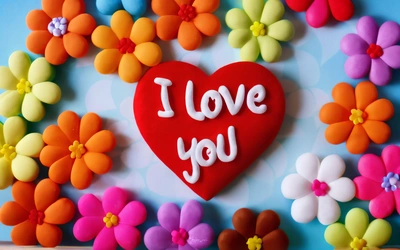 A heart shaped cookie with i love you written on it surrounded by flowers and petals on a blue background with a white border of white lettering, love, a 3d render, naive art